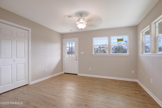 interior space with ceiling fan and light wood-type flooring
