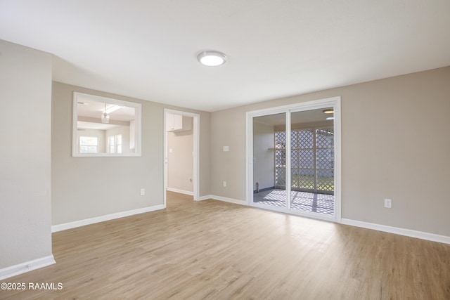 empty room with plenty of natural light and light wood-type flooring
