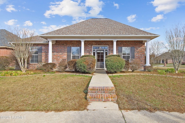 bungalow-style house featuring a front yard