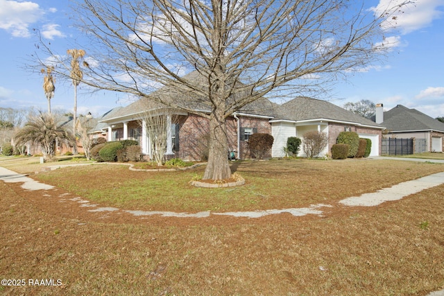 view of front facade with a garage and a front yard