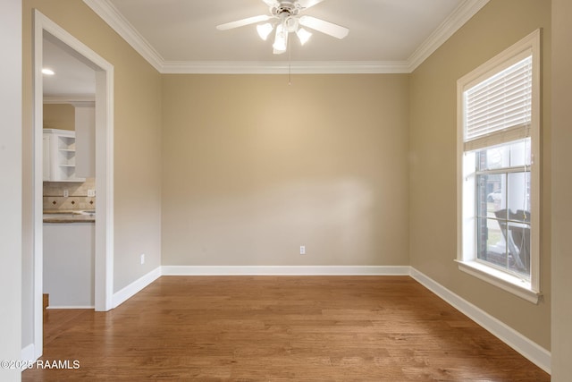 empty room featuring ornamental molding, ceiling fan, and light hardwood / wood-style floors