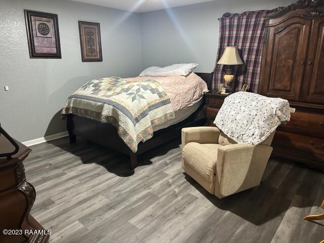 bedroom with light hardwood / wood-style floors