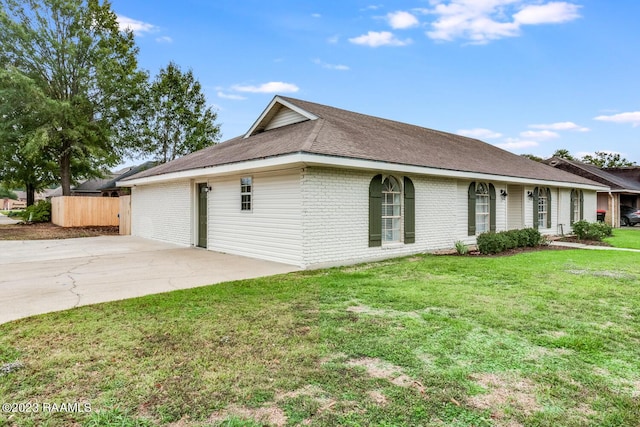 view of property exterior with a lawn