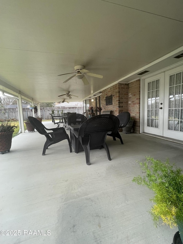 view of patio with french doors and ceiling fan