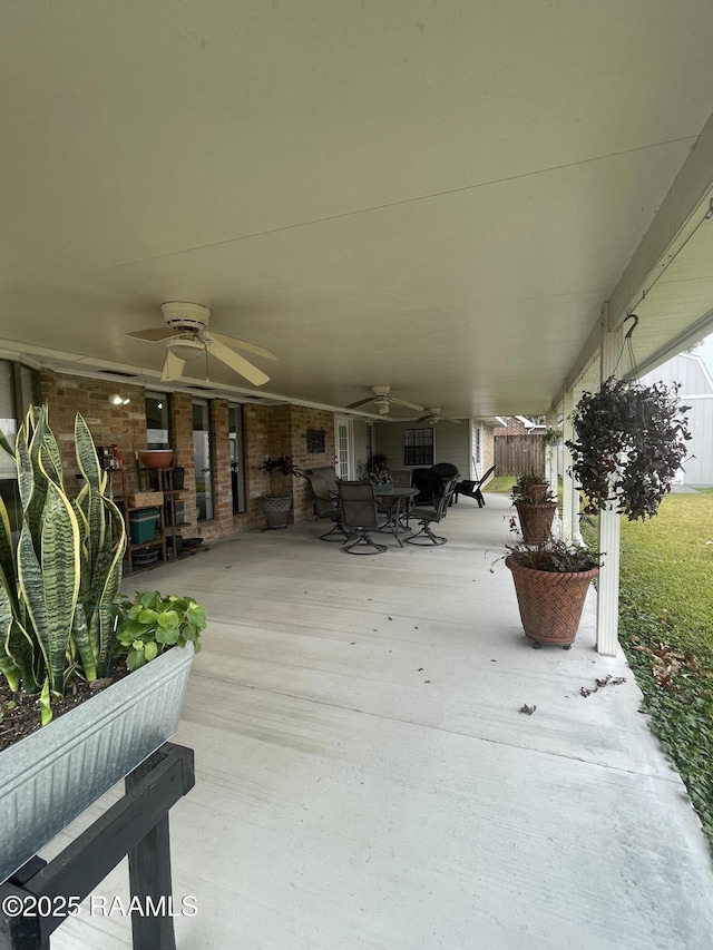 view of patio featuring ceiling fan