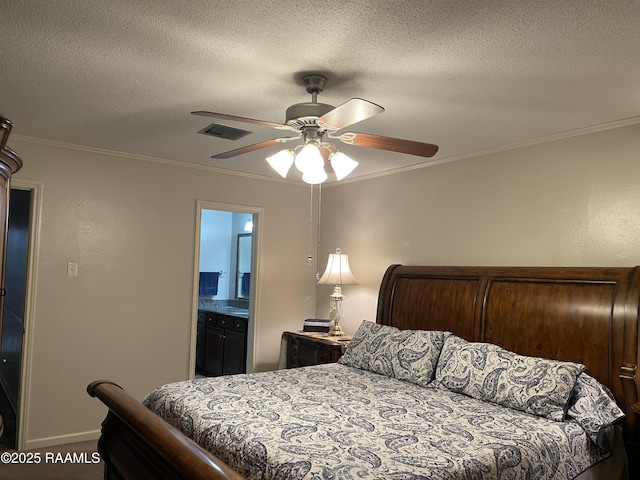 bedroom featuring ceiling fan, ornamental molding, ensuite bathroom, and a textured ceiling