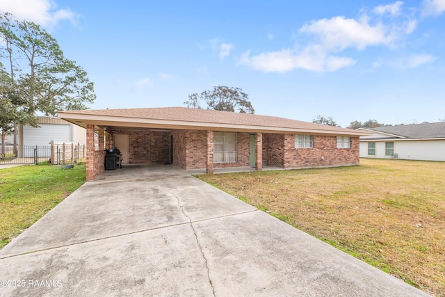 single story home featuring a carport and a front yard