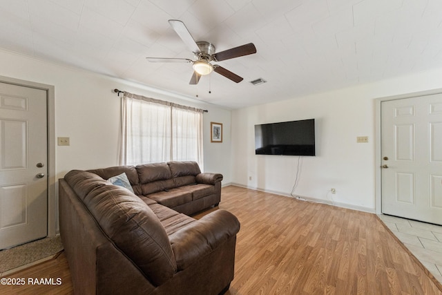 living room with ceiling fan and light hardwood / wood-style floors