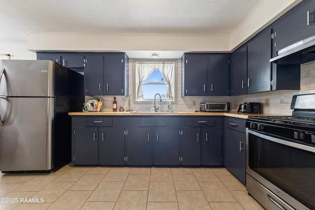 kitchen with tasteful backsplash, sink, ornamental molding, light tile patterned floors, and stainless steel appliances