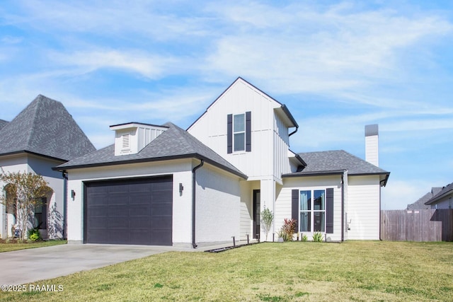 view of front of house with a garage and a front yard