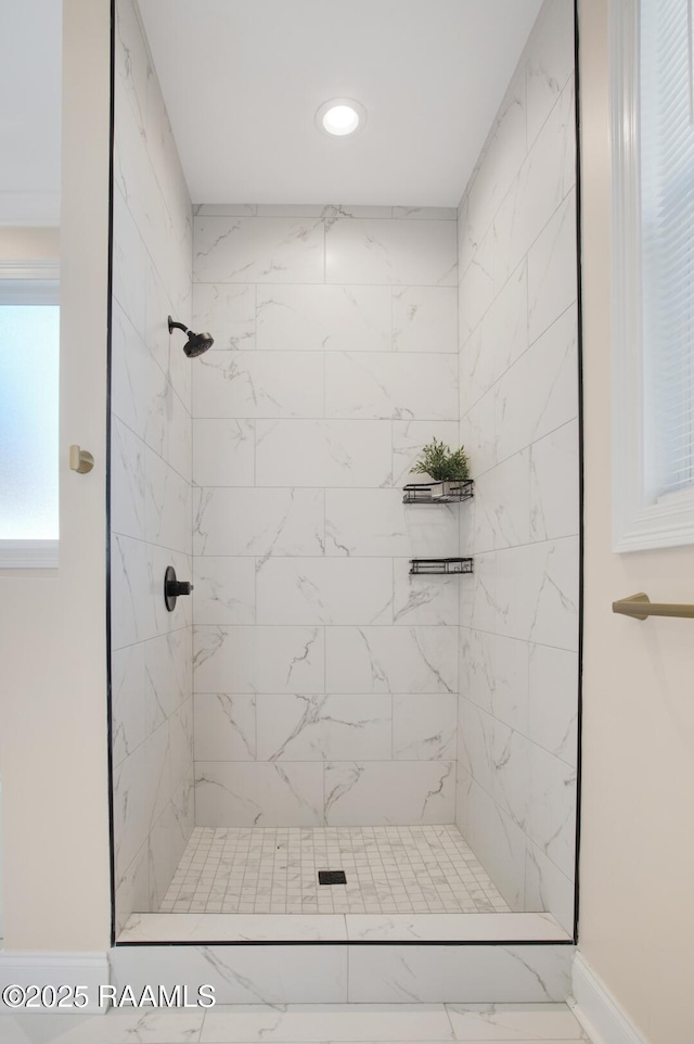 bathroom with a tile shower