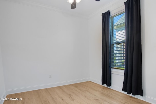 empty room with ornamental molding, ceiling fan, and light hardwood / wood-style floors