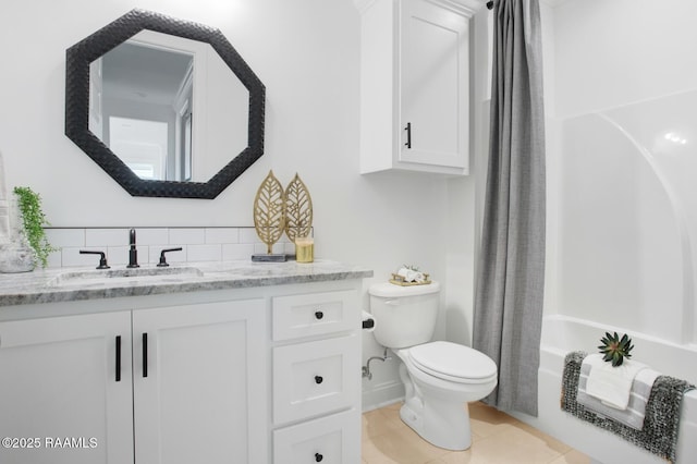 full bathroom featuring tile patterned flooring, backsplash, vanity, shower / bath combination with curtain, and toilet