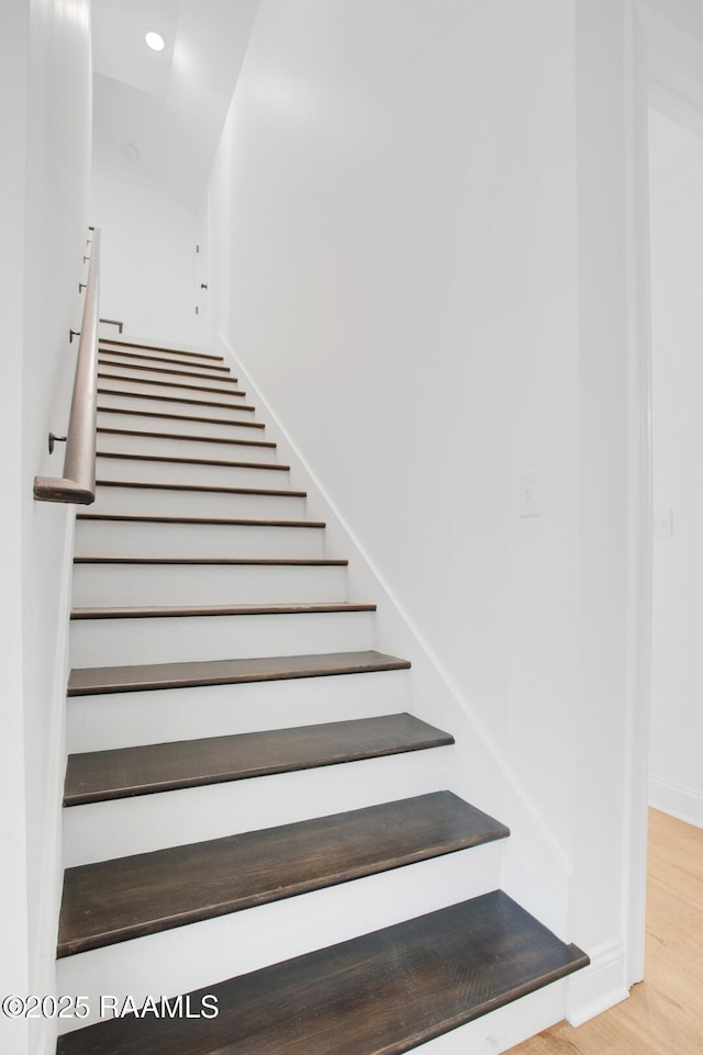 staircase featuring hardwood / wood-style floors