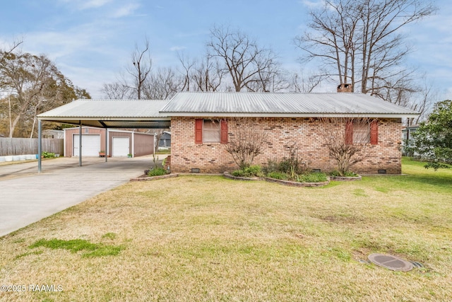 ranch-style house featuring an outbuilding, a carport, a garage, and a front lawn