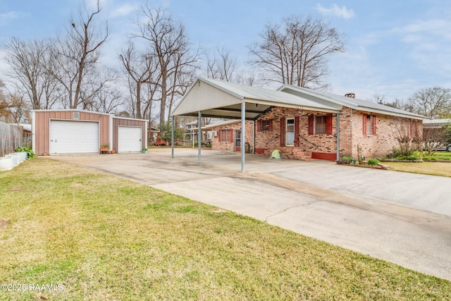 ranch-style house featuring a garage, a carport, an outdoor structure, and a front yard