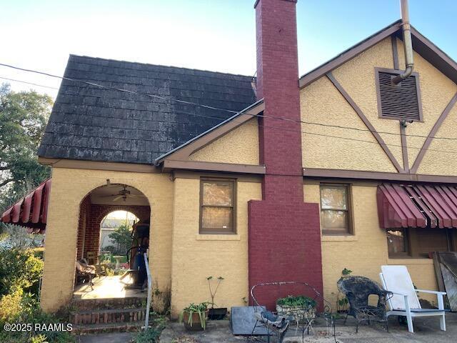 back of house featuring a patio