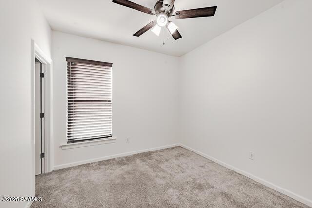 empty room with light carpet and ceiling fan