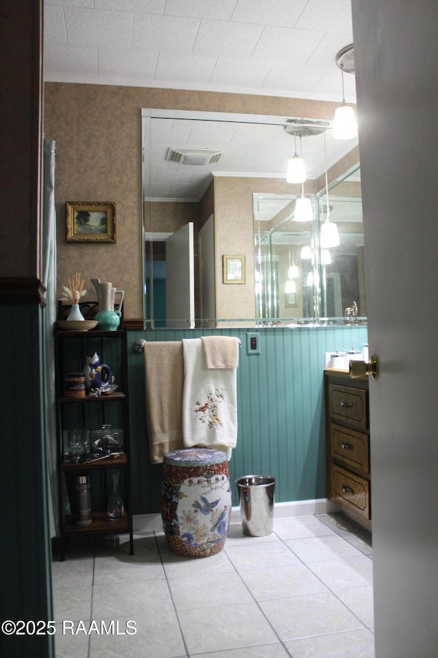 1401 Gregg Ave, Eunice, LA 70535 - bathroom featuring tile patterned flooring, a wainscoted wall, and vanity