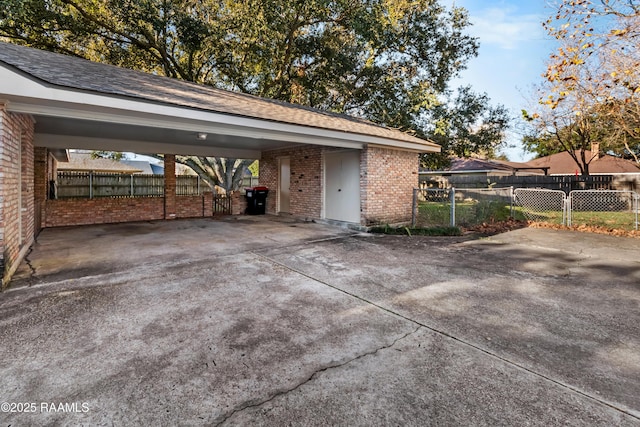 view of vehicle parking featuring a carport