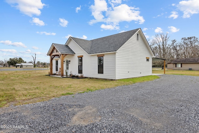 view of front of house with a porch and a front lawn