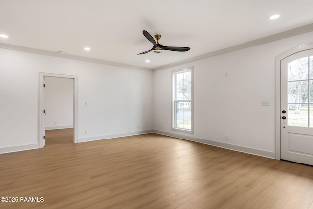 interior space with ornamental molding, light hardwood / wood-style floors, and a wealth of natural light