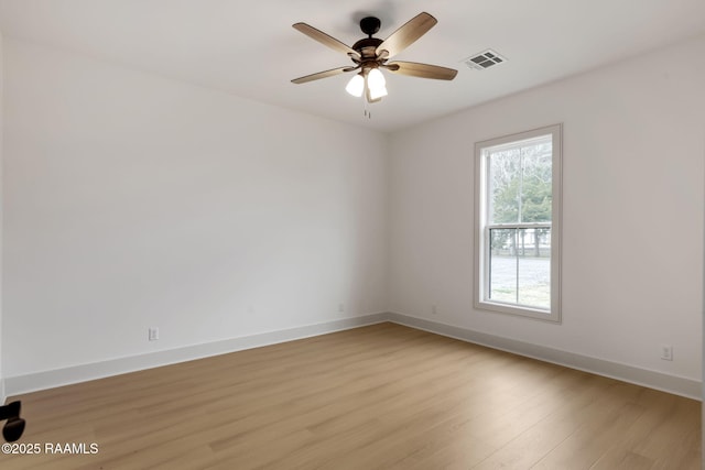 unfurnished room with ceiling fan and light wood-type flooring