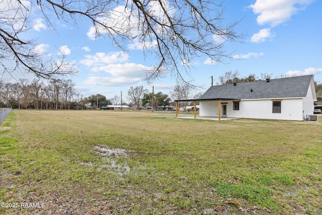 view of yard with a patio and central air condition unit