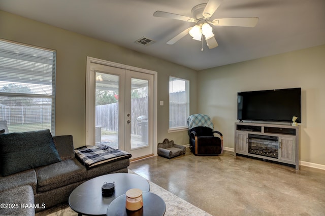 living room with french doors and ceiling fan