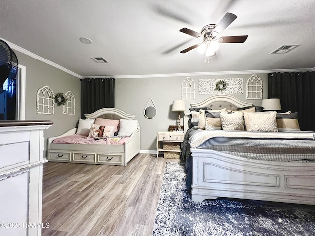 bedroom with hardwood / wood-style floors, a textured ceiling, ornamental molding, and ceiling fan