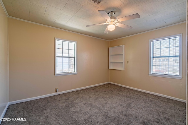 carpeted empty room featuring ornamental molding and ceiling fan