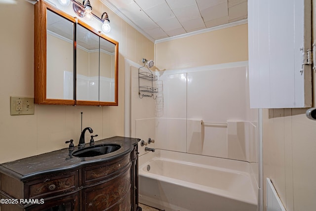 bathroom with vanity, crown molding, and shower / bathtub combination