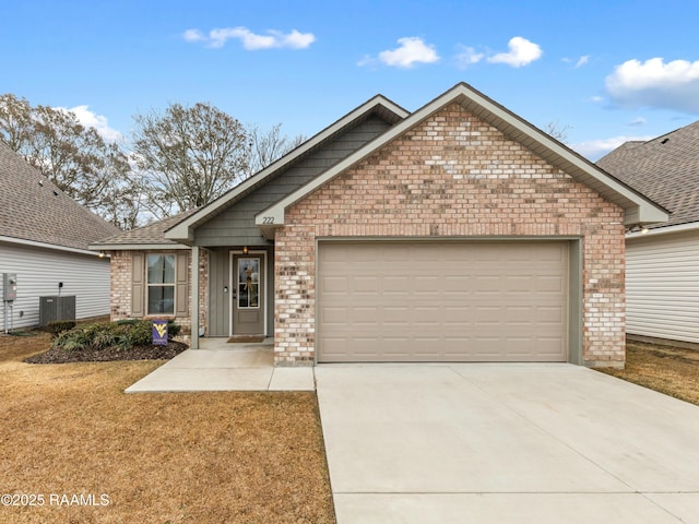 view of front of house featuring a garage, central AC, and a front yard