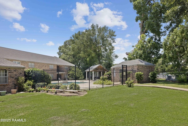 view of yard with a fenced in pool