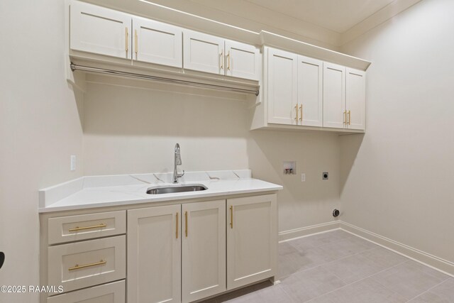 washroom featuring sink, cabinets, ornamental molding, electric dryer hookup, and washer hookup