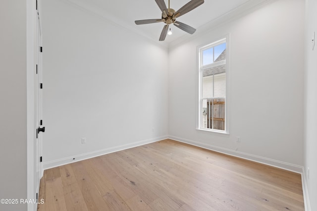 empty room featuring ornamental molding, ceiling fan, and light hardwood / wood-style floors