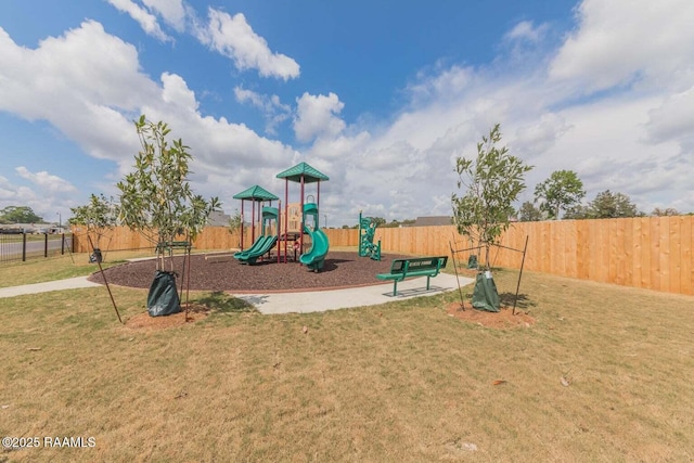 view of jungle gym with a lawn