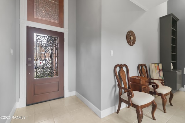 foyer entrance with light tile patterned flooring