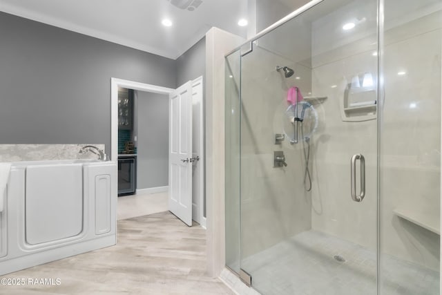 bathroom featuring hardwood / wood-style flooring and a shower with door