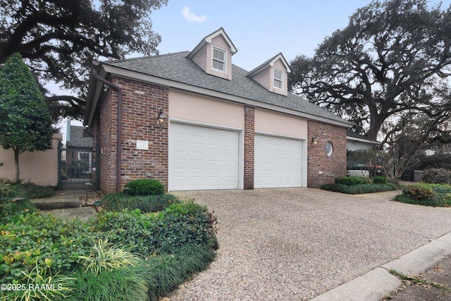 view of side of property featuring a garage