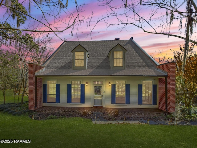 view of front of property with a yard