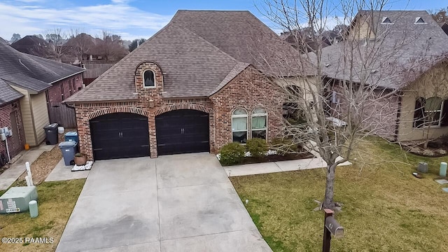 view of front of home with a garage and a front yard