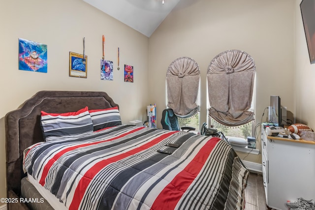 bedroom featuring lofted ceiling