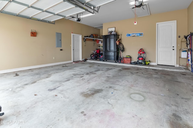 garage with a garage door opener and electric panel