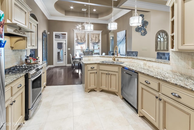 kitchen featuring sink, light tile patterned floors, pendant lighting, stainless steel appliances, and backsplash