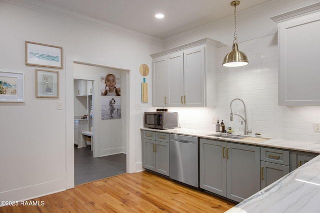 kitchen with white cabinetry, decorative light fixtures, light hardwood / wood-style flooring, gray cabinets, and stainless steel appliances