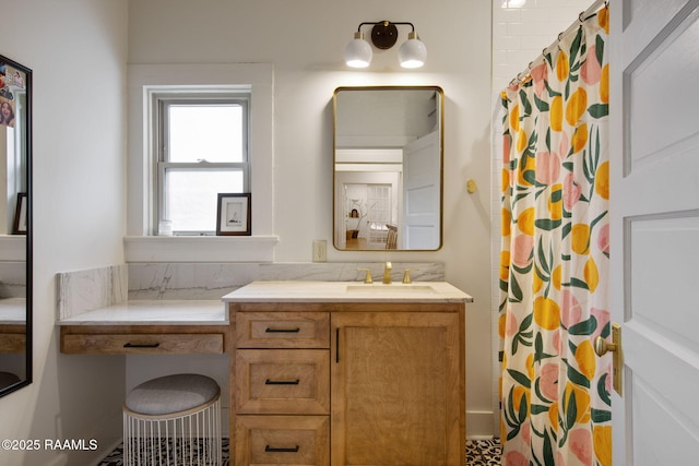 bathroom featuring vanity and curtained shower