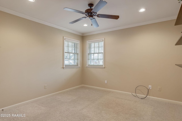 unfurnished room featuring crown molding, carpet flooring, and ceiling fan