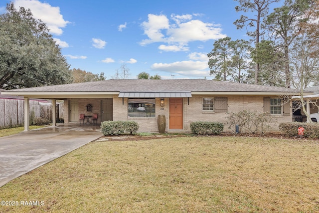 ranch-style house with a front yard and a carport