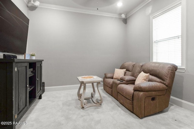 living area featuring crown molding and carpet flooring